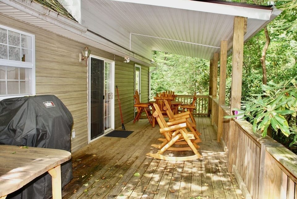 Rocking chairs and gas grill back porch