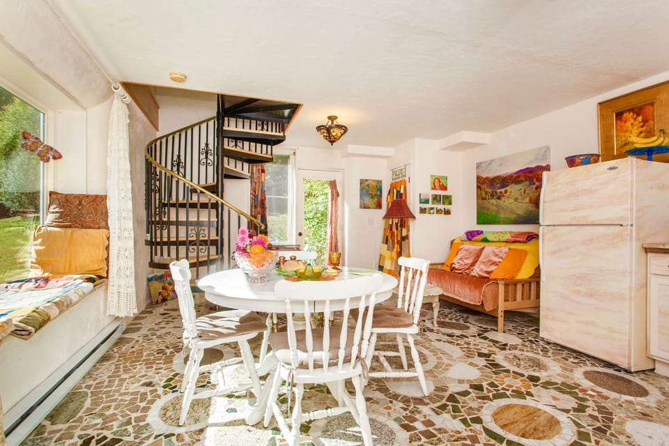 Dining area with mosaic floor called "Stepping Stones through a Flower Garden."