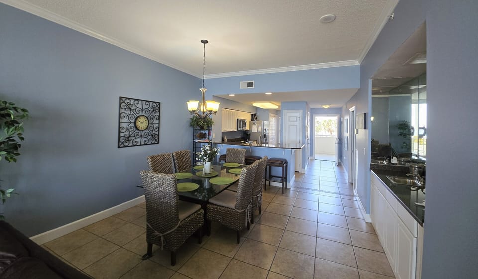 Dining room with seating for 6. A wet bar on the right side. 