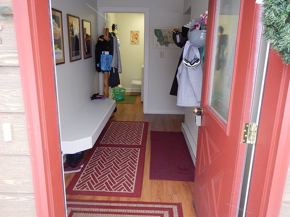 Front door to the mud room. Mud room has bench and hooks for your gear. 