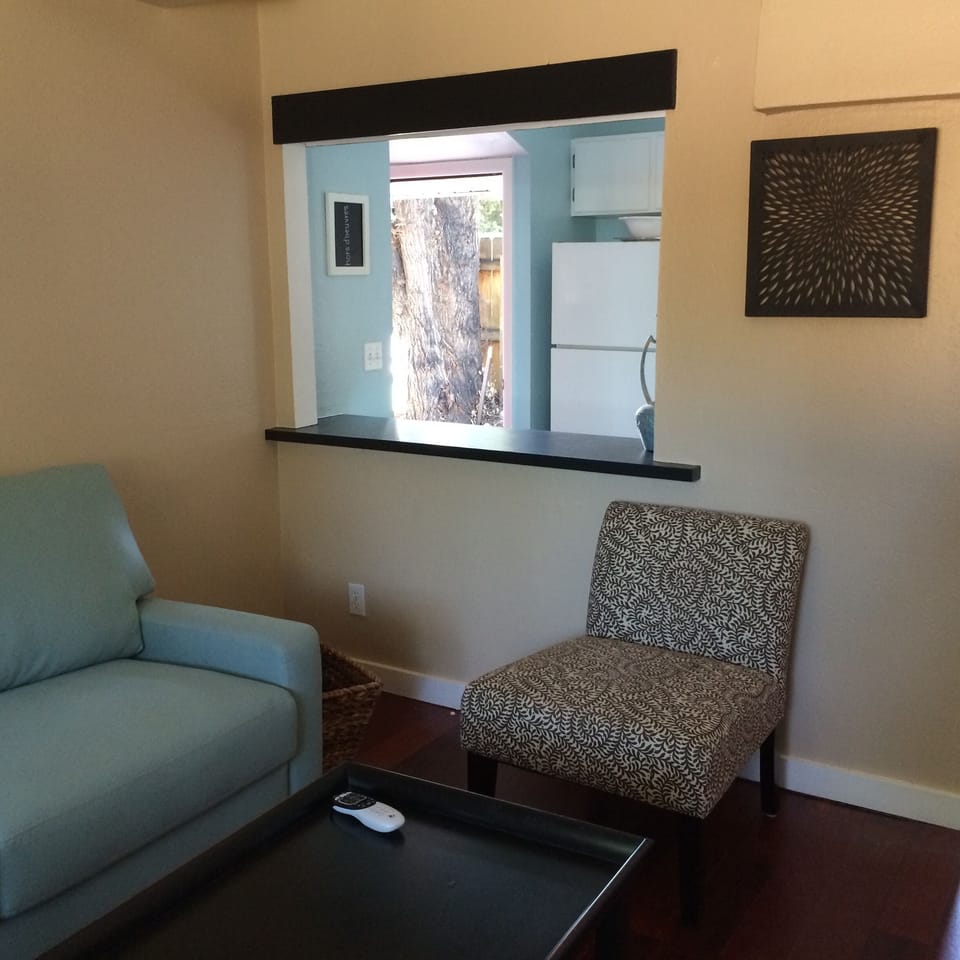 View through bar, from family room to kitchen.