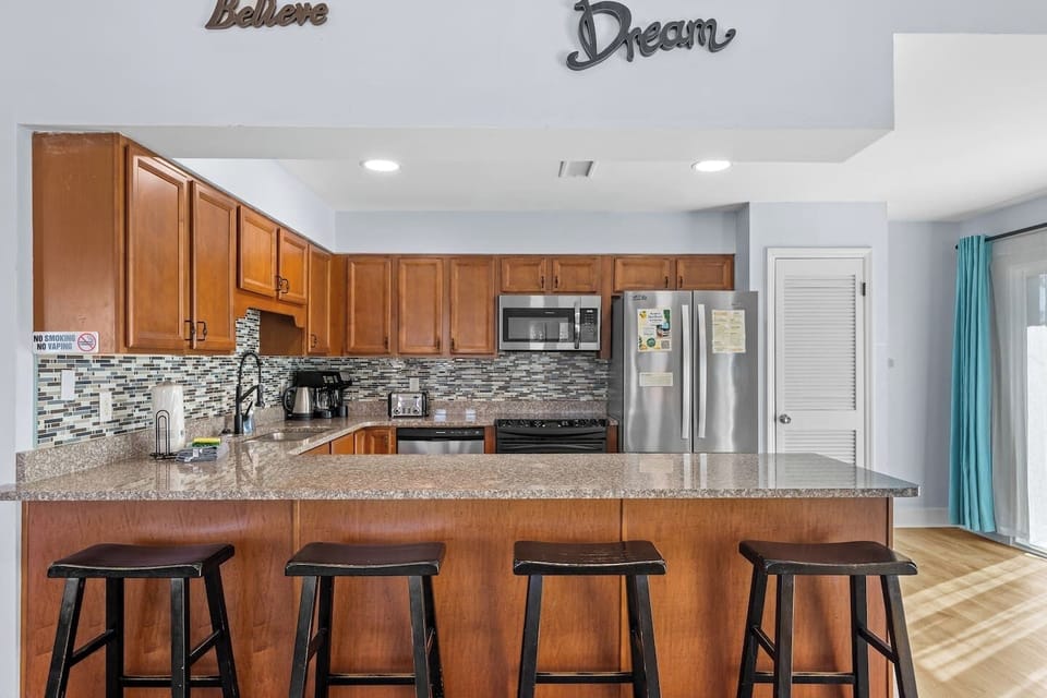 Kitchen with everything you need to cook yummy meals for a large group with island and bar seatings
