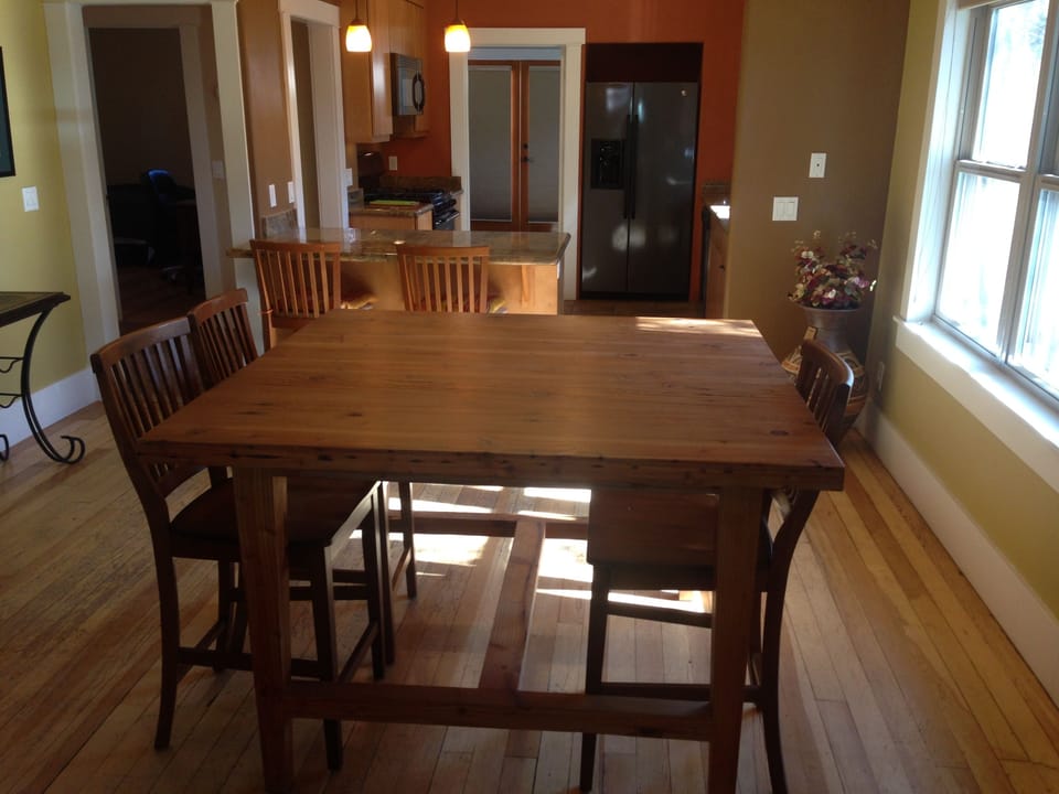 Dining area with kitchen and then  laundry room through the door