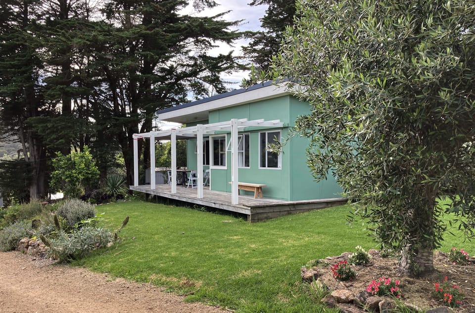 The bach is set in a generous garden and has a north-facing deck