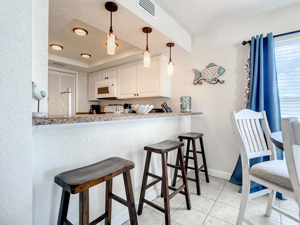 Seating for 3 at the kitchen counter.