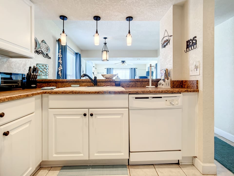 Full Kitchen with Open View of the Living area and ocean.