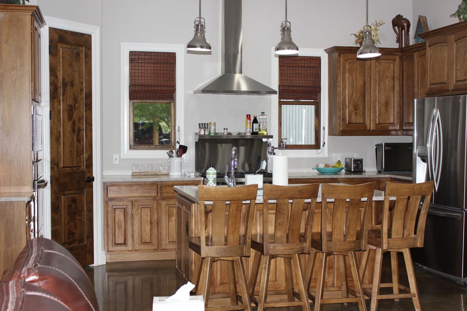 Island seating, LG/Thermador appliances, Wolfe Range, Ninja coffeemaker.