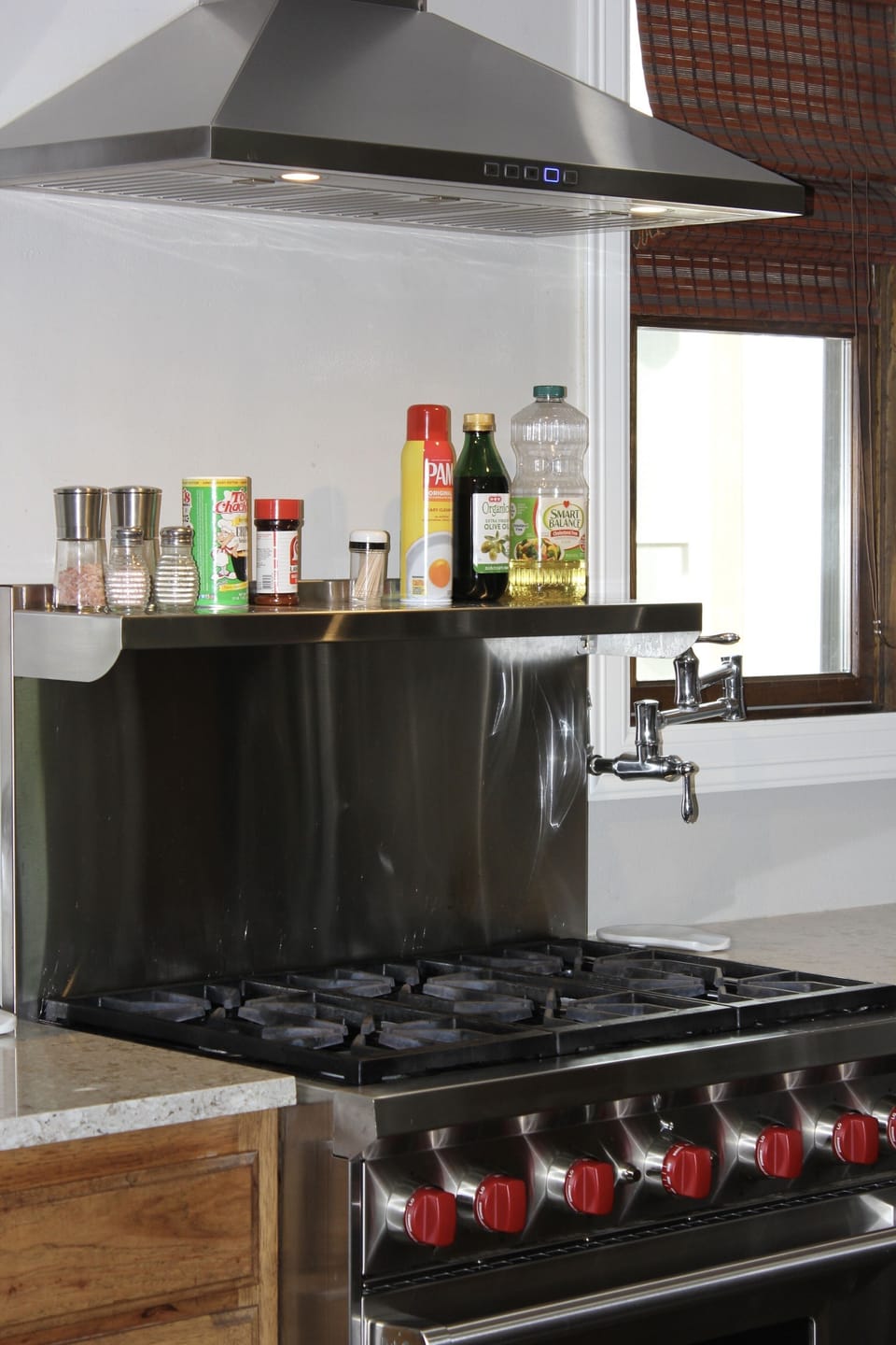 This is a chef's kitchen, after all, and includes a Wolf range and many pots.