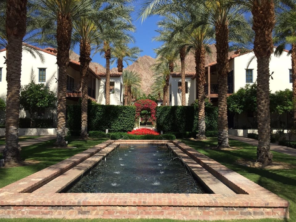 Common area w/ beautiful landscaping, walkways, fountains, fireplaces & hammocks