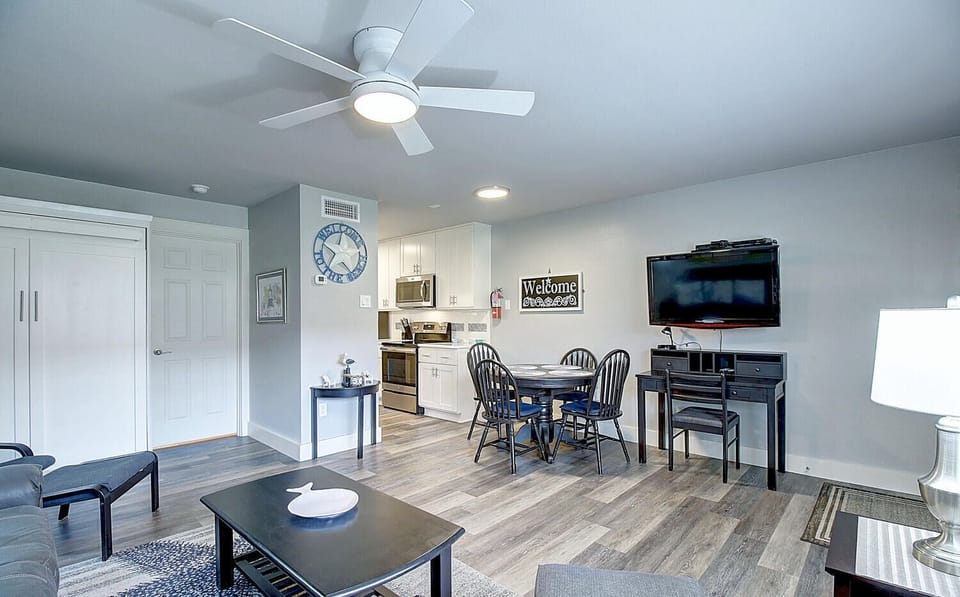 Your open-concept living space combines comfort with convenience, featuring a fully equipped kitchen, dining area, and cozy seating.