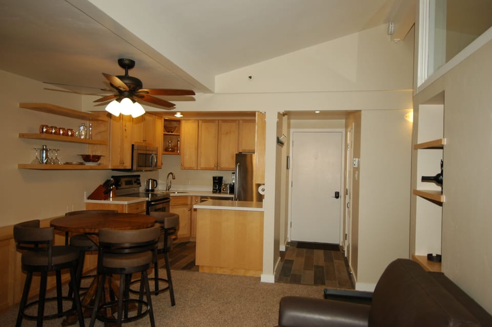 Cathedral Ceiling and Handcrafted Cabinets & Shelving Throughout