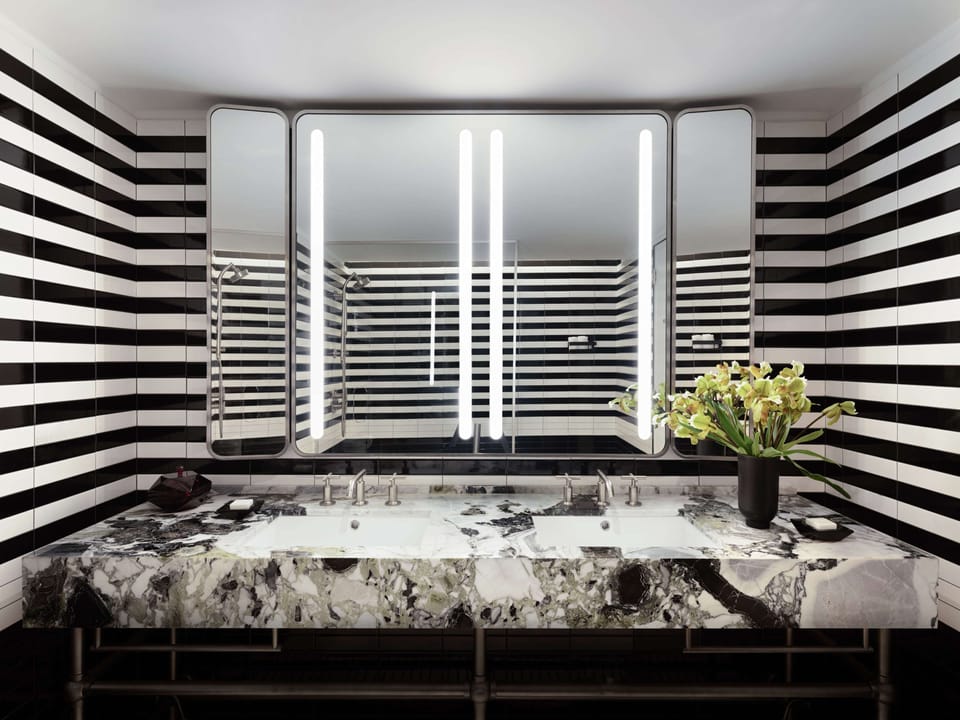 Combined shower/tub, designer toiletries, hair dryer, bathrobes