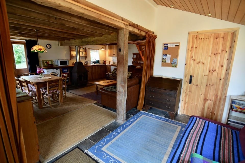 hall leading to open plan kitchen/diner/lounge and door to downstairs bedroom