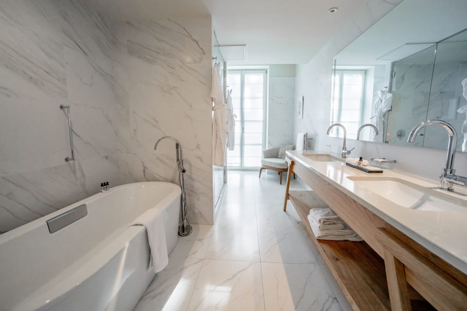 Superior Suite | Bathroom | Designer toiletries, hair dryer, bathrobes, slippers