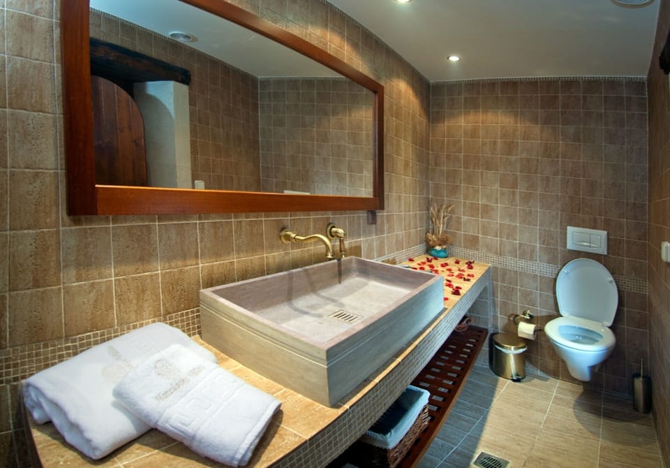 upstairs bathroom with apivita toiletries 