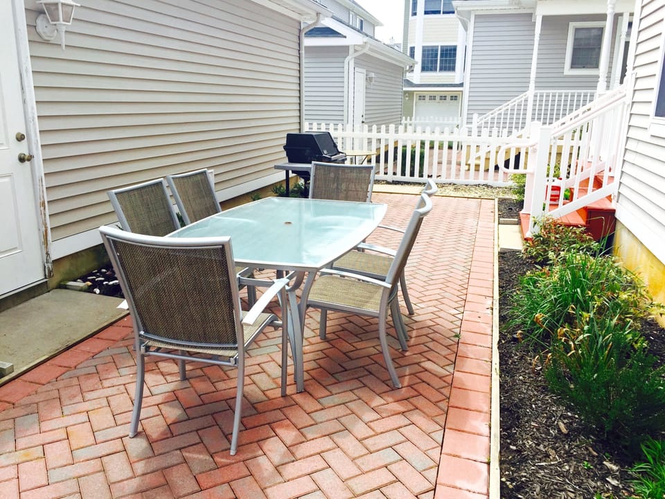 Fenced in Backyard with Grill and Seating area