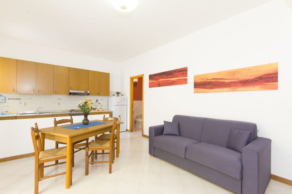 Apartment, 2 Bedrooms, 2 Bathrooms (Nettuno ) | Living area | Flat-screen TV