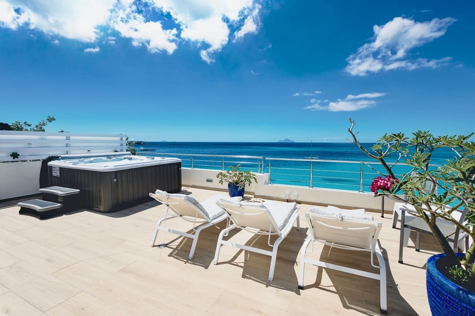 Sun bathing area with hot tub on roof top terrace