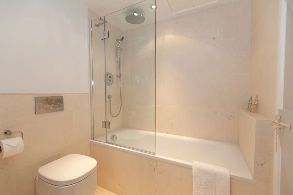 Full size bath and rain forest shower