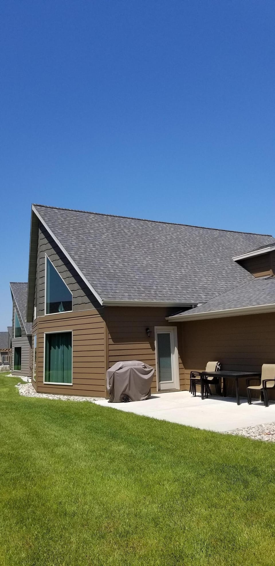 Patio and backyard. Grassy area for games. 