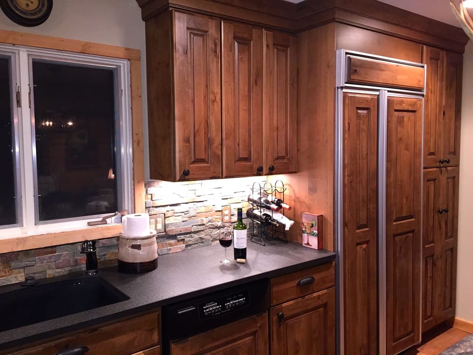 Beautiful Kitchen: Custom Knotty Alder, Honed Granite, stacked slate.