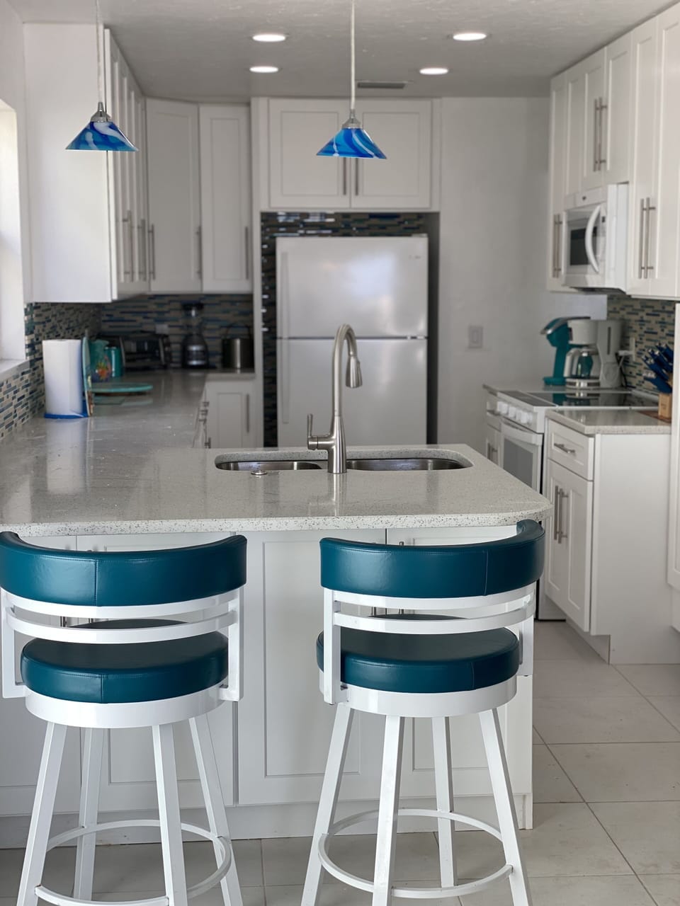 New kitchen w/ quartz countertops & shaker cabinets with views of Gulf of Mexico