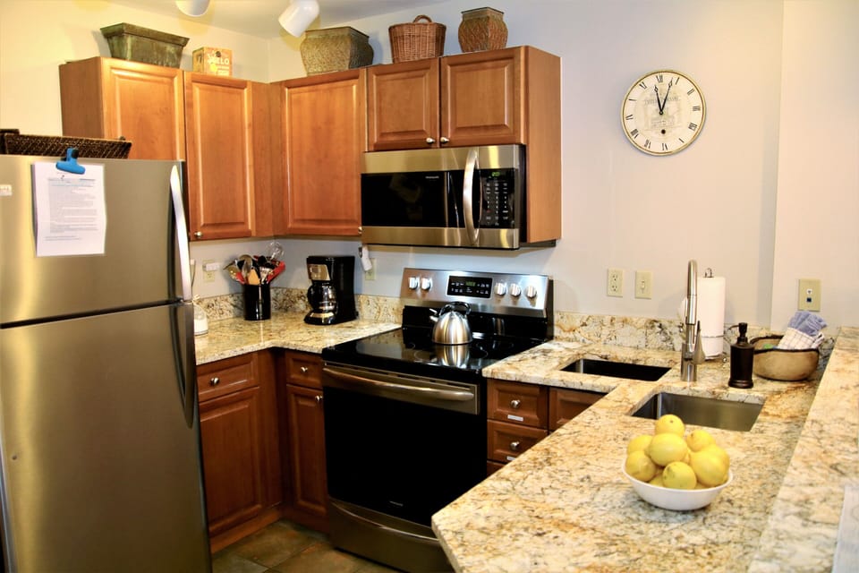 Fully equipped kitchen with crockpot, electric tea kettle, pot/pans, plates, etc
