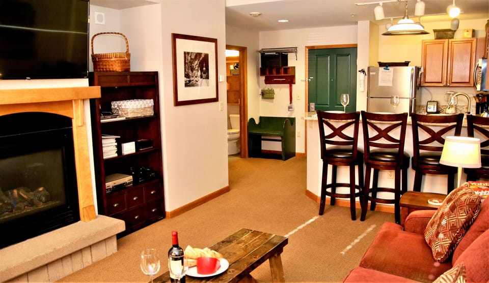 Gas fireplace, smart TV, books, board games, toys & xbox in family room.