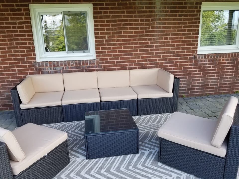 New outdoor sofa on the covered deck provides shade and comfort
