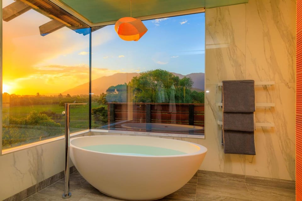 Olive House | Bathroom | Hair dryer, bathrobes, slippers, towels