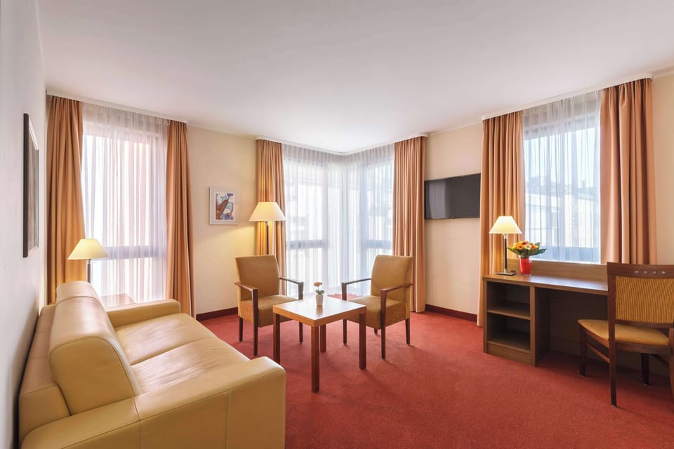 Suite, 1 Double Bed, Refrigerator (Separate Living Room;with Sofabed) | Down comforters, in-room safe, laptop workspace, blackout drapes