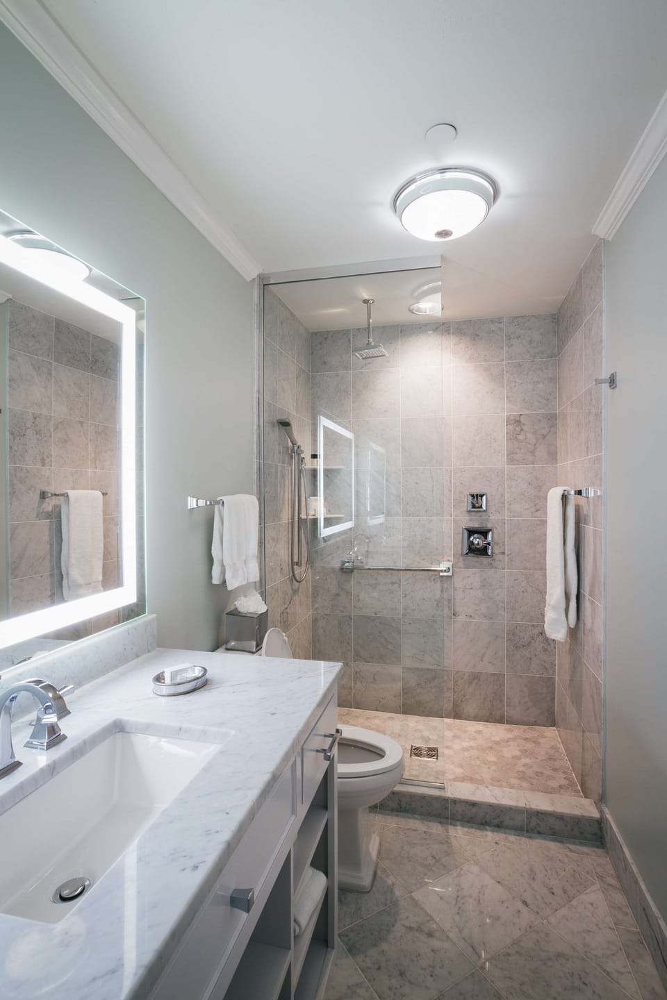 Shower, rainfall showerhead, designer toiletries, hair dryer