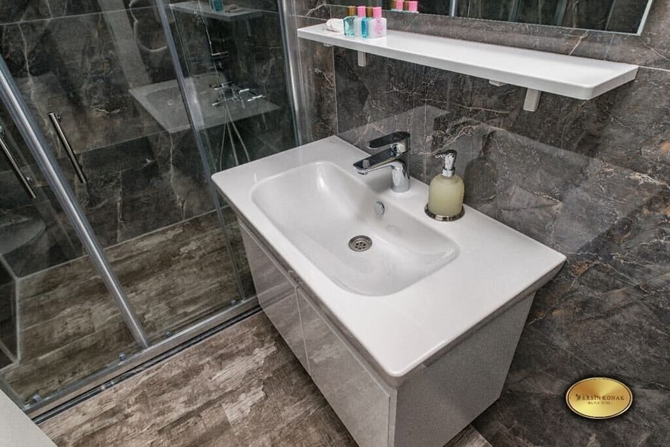 Shower, free toiletries, hair dryer, slippers