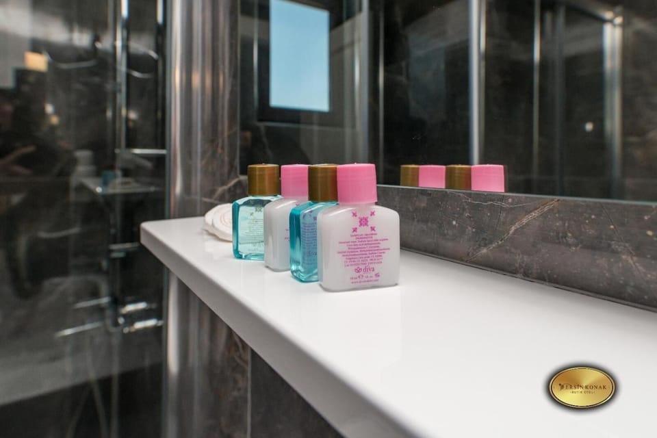 Shower, free toiletries, hair dryer, slippers