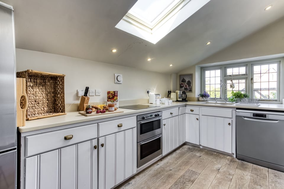 The cottage kitchen, flooded with light