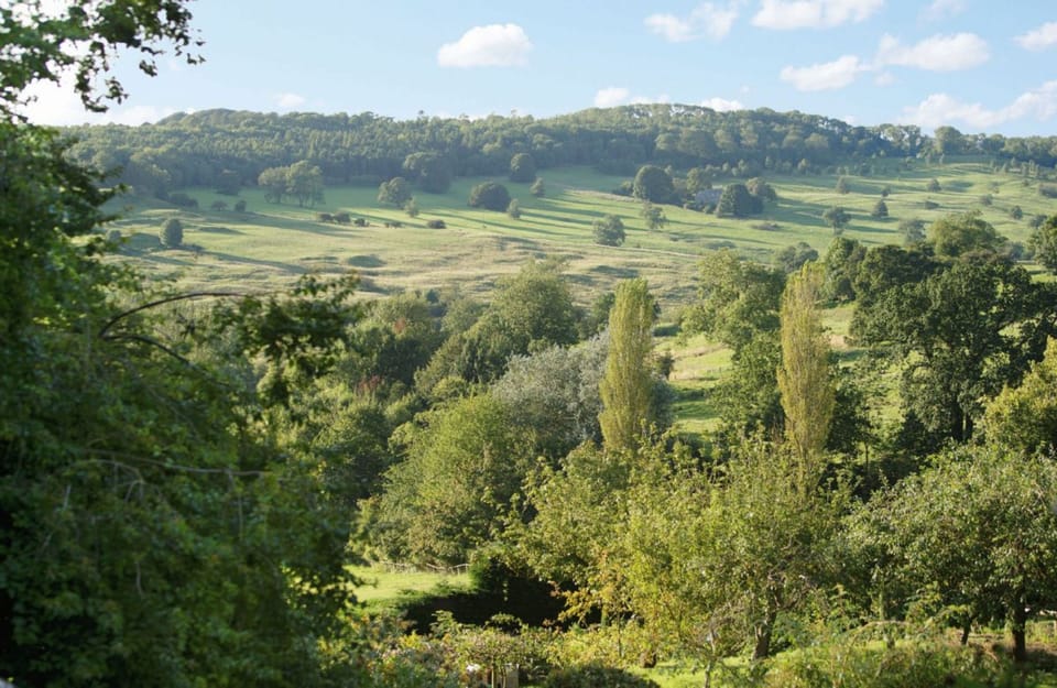 Far-reaching views of rolling Cotswolds countryside from Snowshill