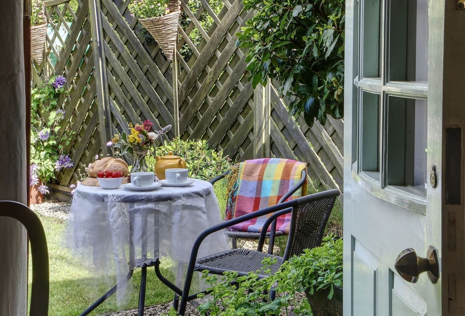 To the front of the cottage you'll find a pretty cottage garden and garden furniture