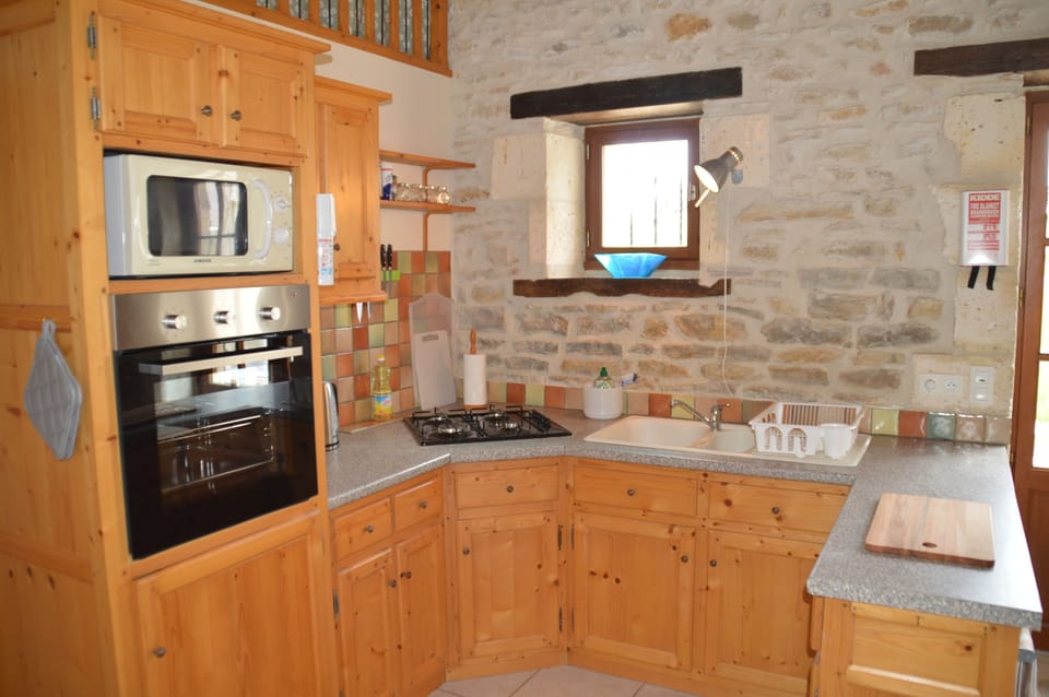 Traditional Cottage, 2 Bedrooms, Pool View, Garden Area (Le Poirier) | Private kitchen | Full-size fridge, microwave, oven, stovetop