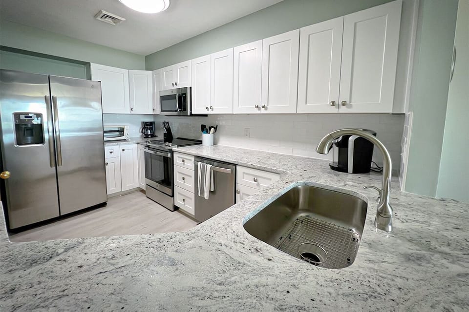 Modern and well-equipped kitchen, featuring high-end appliances and plenty of counter space.