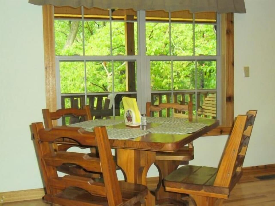 Dinner time overlooking the lush green mountain canopy in the dining room.
