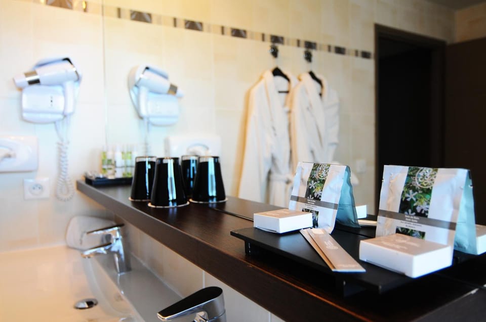 Bathtub, hair dryer, towels