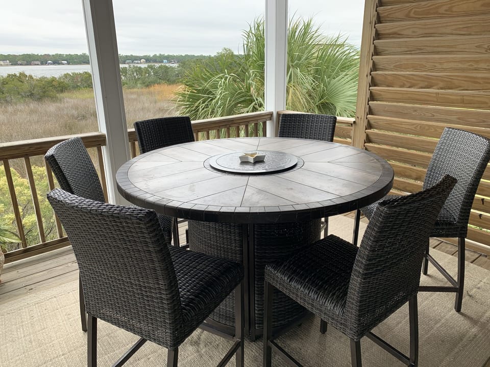 Main Level Balcony - Table has 6 chairs + 2 additional 