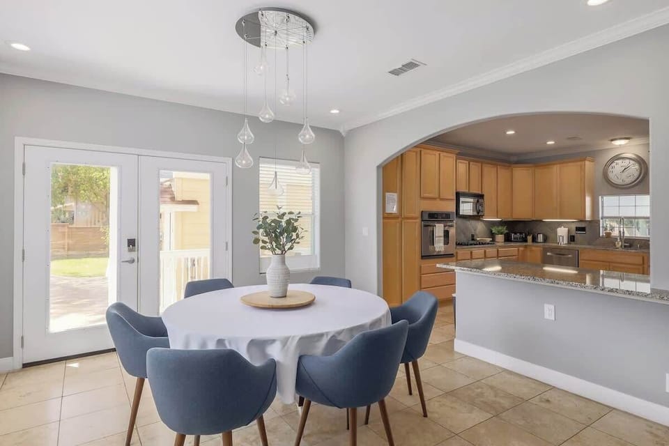 The dining area is off of the kitchen and living area and seats 6