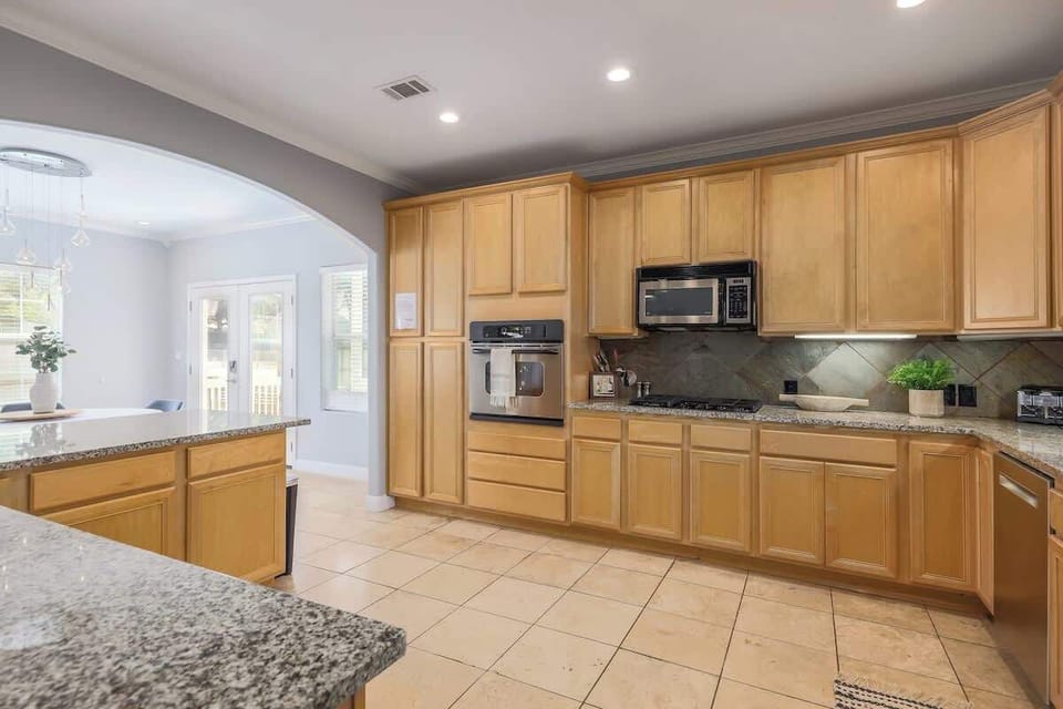 Prepare your favorite meal in the well-stocked kitchen which has stainless steel appliances and ample counter space