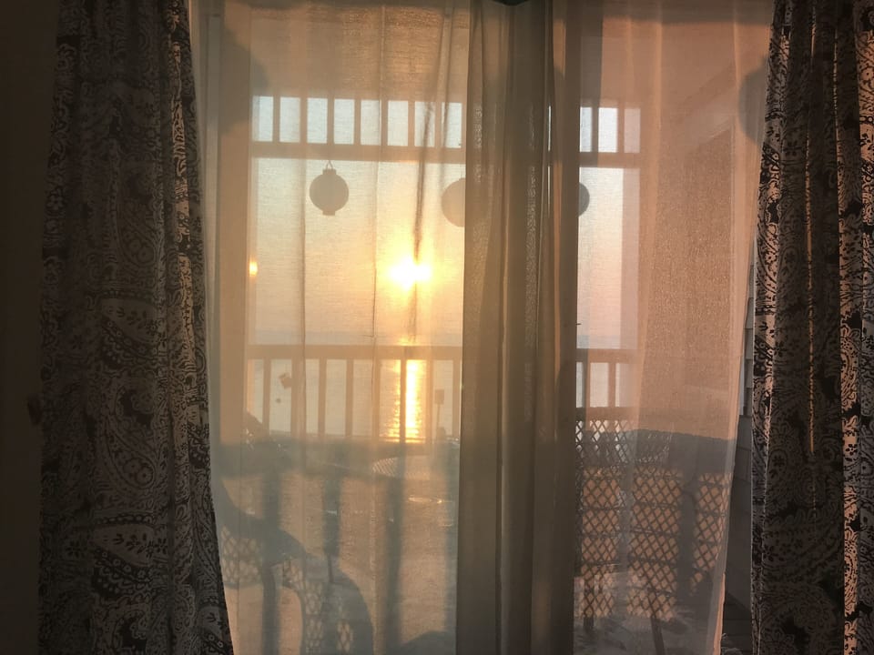 A view of the sunrise from the air conditioned primary bedroom.