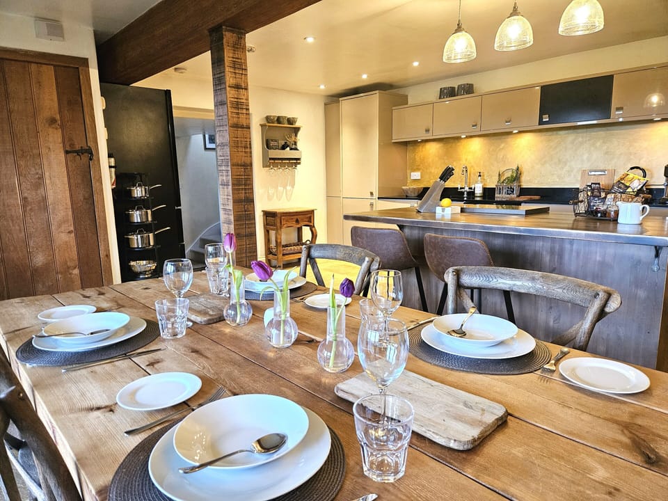 spacious  dining area, looking over breakfast bar to kitchen area