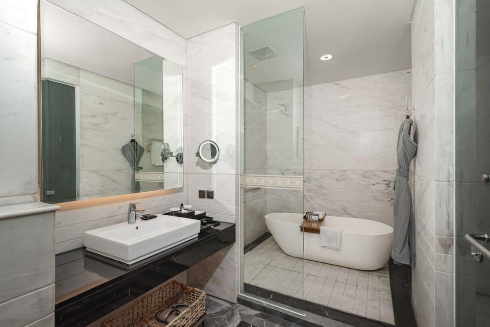 Separate tub and shower, free toiletries, hair dryer, bathrobes