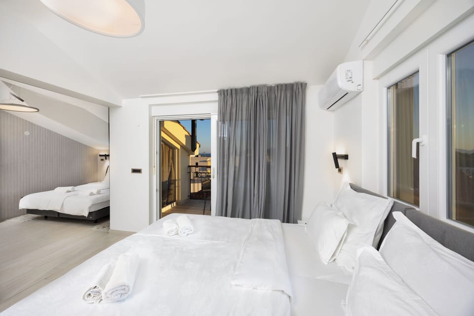 Quadruple Room | Premium bedding, down comforters, Tempur-Pedic beds, in-room safe