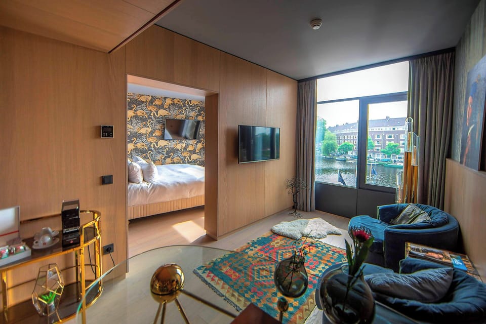 Design Room, 1 Bedroom, Canal View | Living room | LCD TV