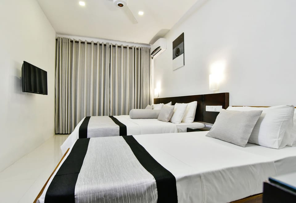 Standard Triple Room, 1 Bedroom, Mountain View | Premium bedding, desk, blackout drapes, iron/ironing board